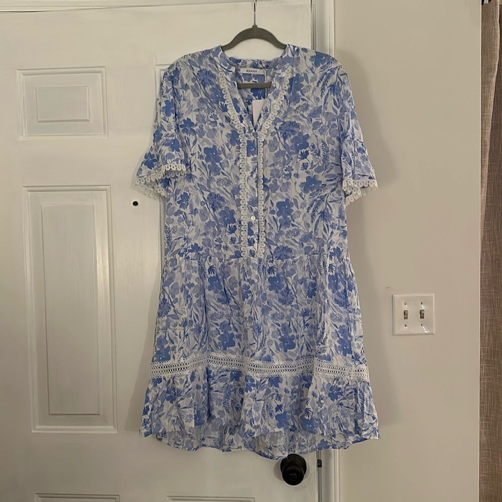 Blue floral dress with ruffle bottom and button down the front detail